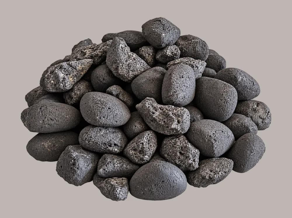A heap of dark grey fuel, smooth rounded ovoids mixed with rough, pitted lumps of pet coke